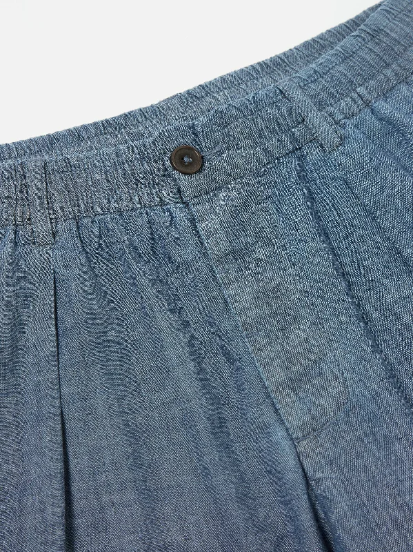 universal-works-patched-pleated-track-pant-in-indigo-chambray-hickory