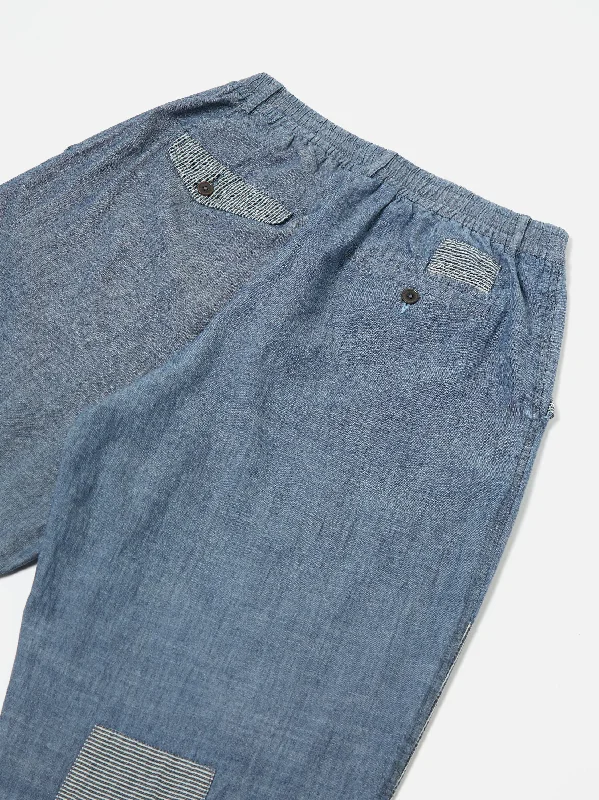 universal-works-patched-pleated-track-pant-in-indigo-chambray-hickory