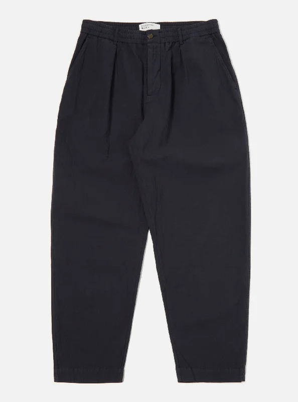 universal-works-pleated-track-pant-in-navy-seersucker-ii