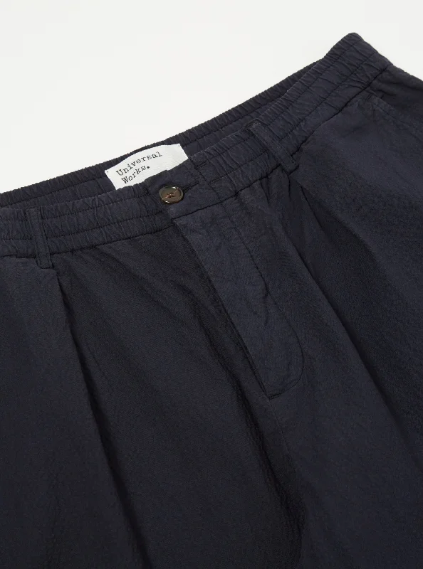 universal-works-pleated-track-pant-in-navy-seersucker-ii