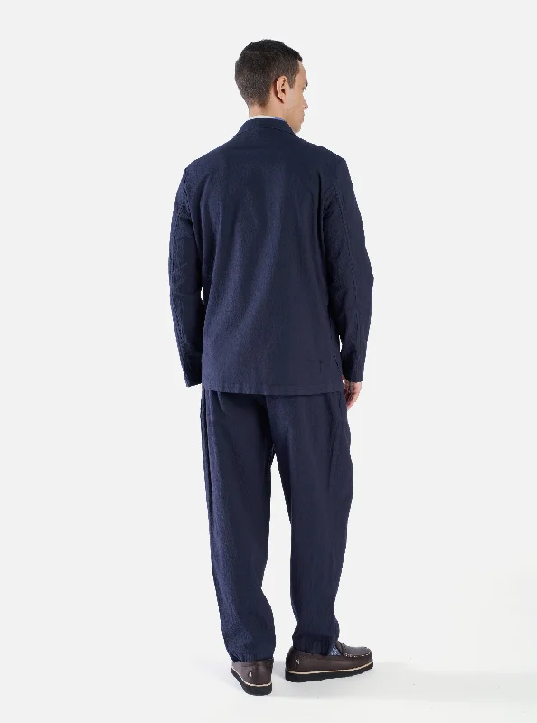 universal-works-pleated-track-pant-in-navy-seersucker-ii