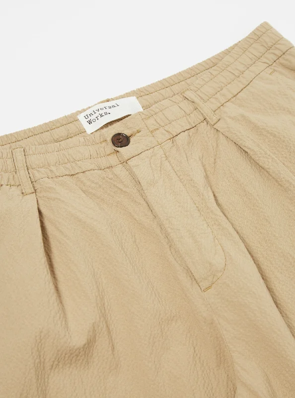 universal-works-pleated-track-pant-in-summer-oak-seersucker-ll